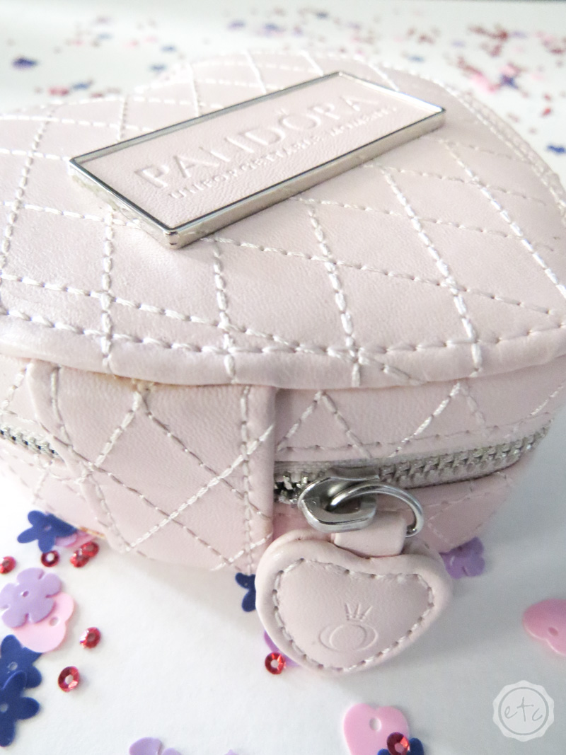 A close up of the logo on this pandora jewelry case