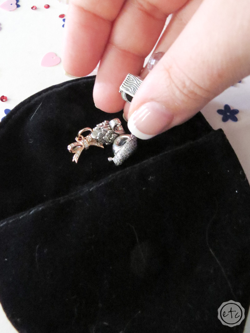 Putting charms inside this little pandora jewelry pouch